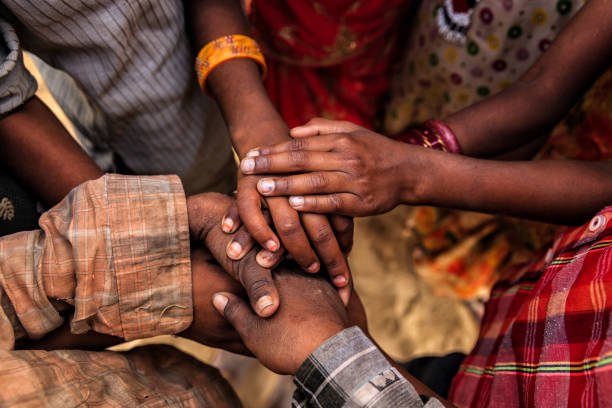 Children's hands in one of Indian villages showing unity.